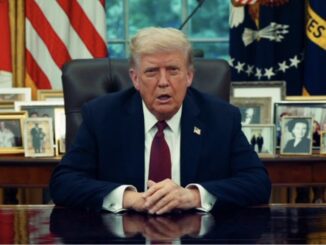 Man sitting at a desk, formal setting.