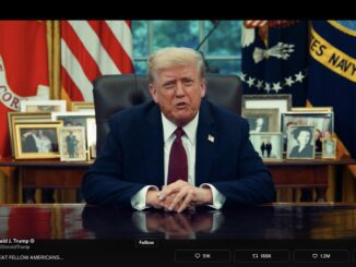 Man at executive desk with framed photographs