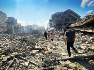 People walking through urban rubble and debris.