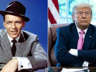 Two men sitting, one in suit, hat.