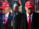 Man in red hat with reflection.