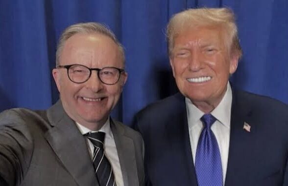 Two men smiling in suits and ties. Two men smiling in suits and ties.