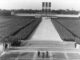 Nazi rally with soldiers in formation.