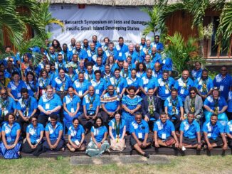 Group photo at Pacific symposium, blue shirts.