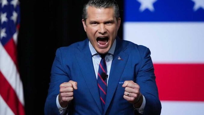 Man in suit speaking passionately on stage. Man in suit speaking passionately on stage.