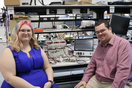 Two people in a technology lab setting. Two people in a technology lab setting.