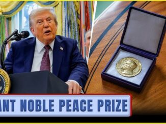 Man speaking beside Nobel Peace Prize medal.
