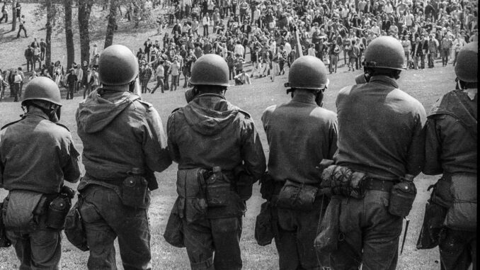 Soldiers facing crowd during protest. Soldiers facing crowd during protest.