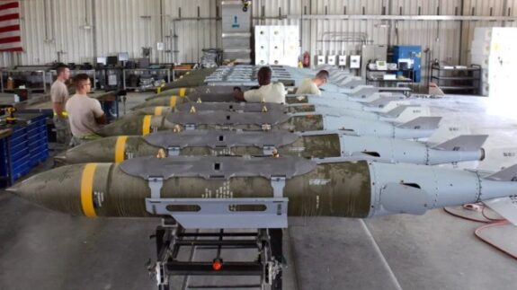 Missiles lined up in a maintenance facility.