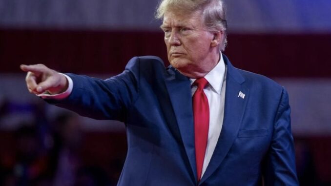 Man in suit pointing with serious expression. Man in suit pointing with serious expression.