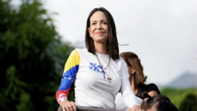 Woman in colorful shirt outdoors, smiling confidently.