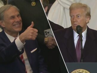 Two men, one giving a thumbs-up.