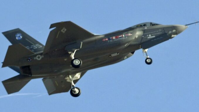 Jet fighter flying in clear blue sky. Jet fighter flying in clear blue sky.