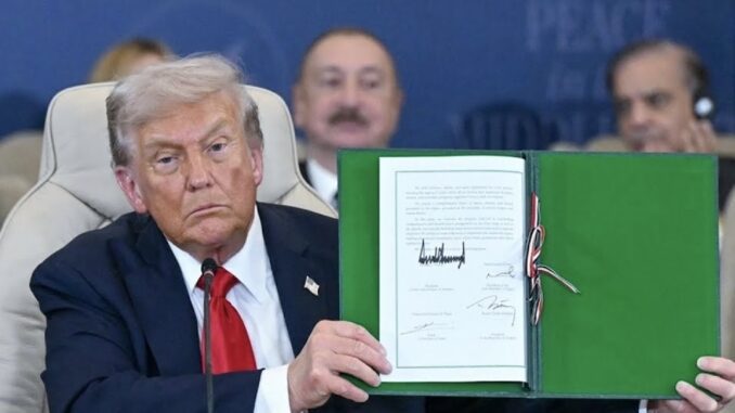 Man displaying signed document at event. Man displaying signed document at event.