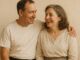 Smiling couple embracing and looking at each other.