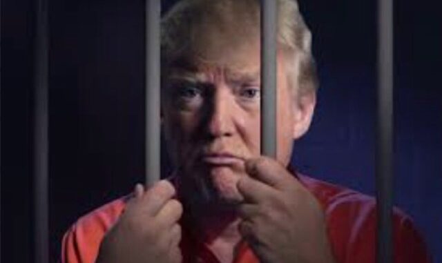 Person behind bars wearing an orange shirt. Person behind bars wearing an orange shirt.