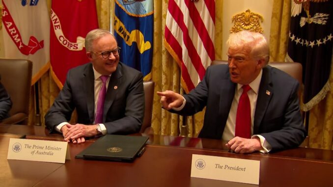 Two men sitting at a conference table. Two men sitting at a conference table.