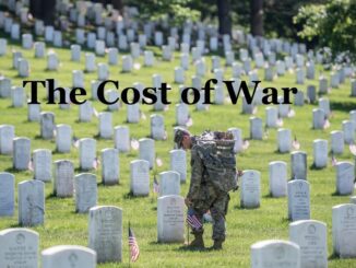 Soldier in cemetery with "The Cost of War.