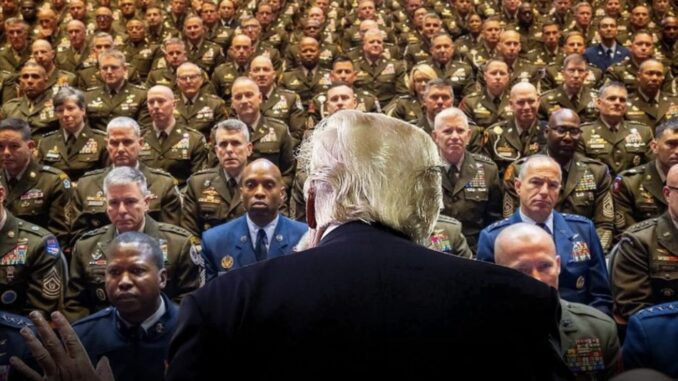 Back view of speaker addressing military audience.