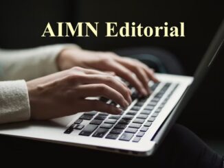 Hands typing on laptop under "AIMN Editorial