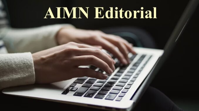 Hands typing on laptop under "AIMN Editorial