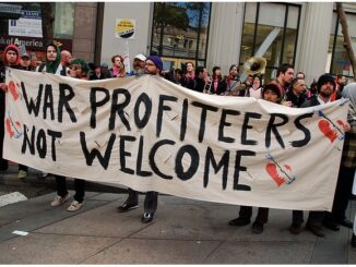 Protesters holding "War Profiteers Not Welcome" banner.