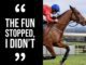 Jockey riding horse with motivational quote.
