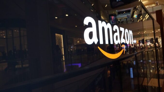 Amazon logo on a glass-walled building.