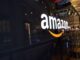 Amazon logo on a glass-walled building.