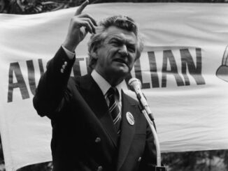 Man giving a speech at a rally.