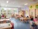 Children learning in a bright classroom setting.