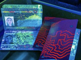 Passports under ultraviolet light showing security features.