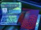 Passports under ultraviolet light showing security features.