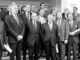 Group of men in suits, black and white.