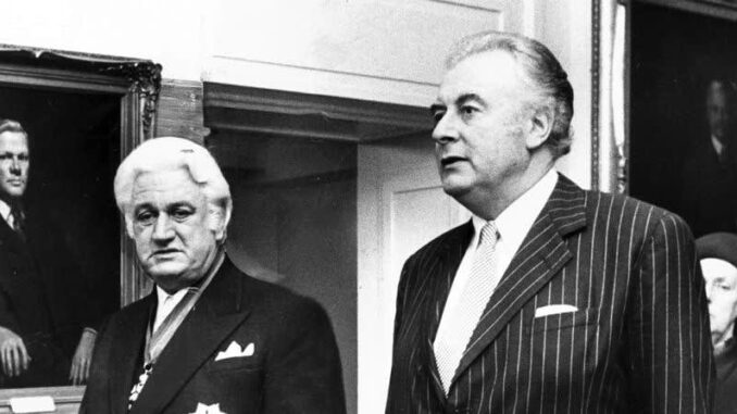 Two men in suits, black and white photo.