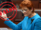 Person in blue suit with "False" stamp.