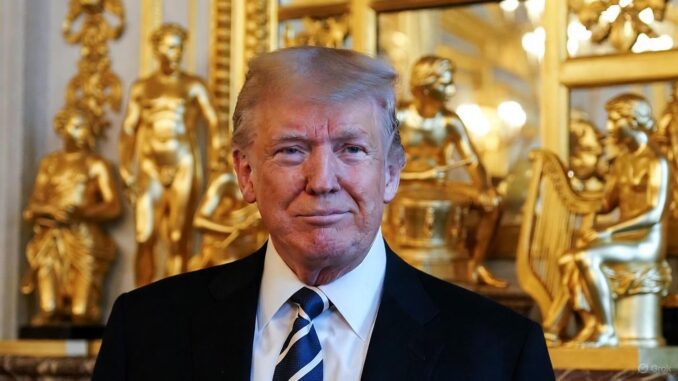 Man in suit with golden statues background.
