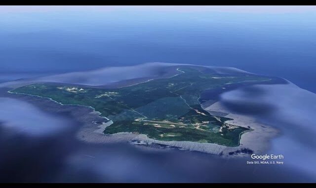 Aerial view of a lush green island.