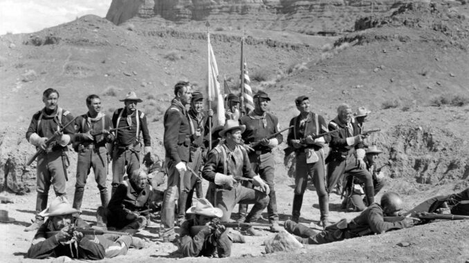 Group of soldiers posing in desert landscape. Group of soldiers posing in desert landscape.