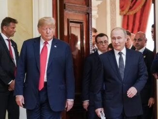 Two men walking through a doorway together.