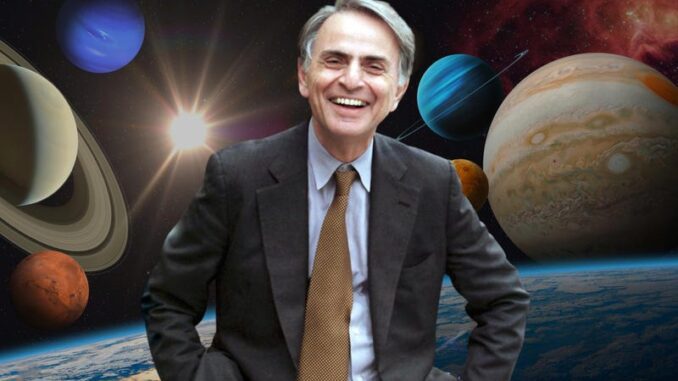 Smiling man with planets in background.