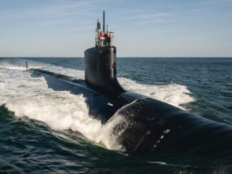 Submarine cruising on the ocean surface.