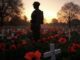 Soldier statue among poppies at sunset.