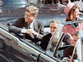 People in a car during a parade.
