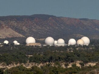 Satellite dishes in a remote mountainous area.