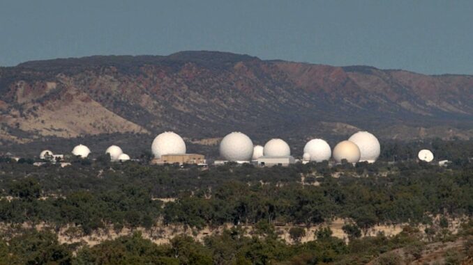 Satellite dishes in a remote mountainous area.