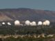 Satellite dishes in a remote mountainous area.