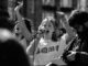 Protesters speaking passionately into a microphone.