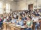 Students attentively listening in a lecture hall.