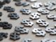 Multiple black and silver dollar signs scattered.
